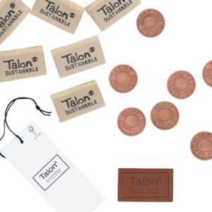 Sustainable hang tags, buttons, labels, and patches by Talon International.